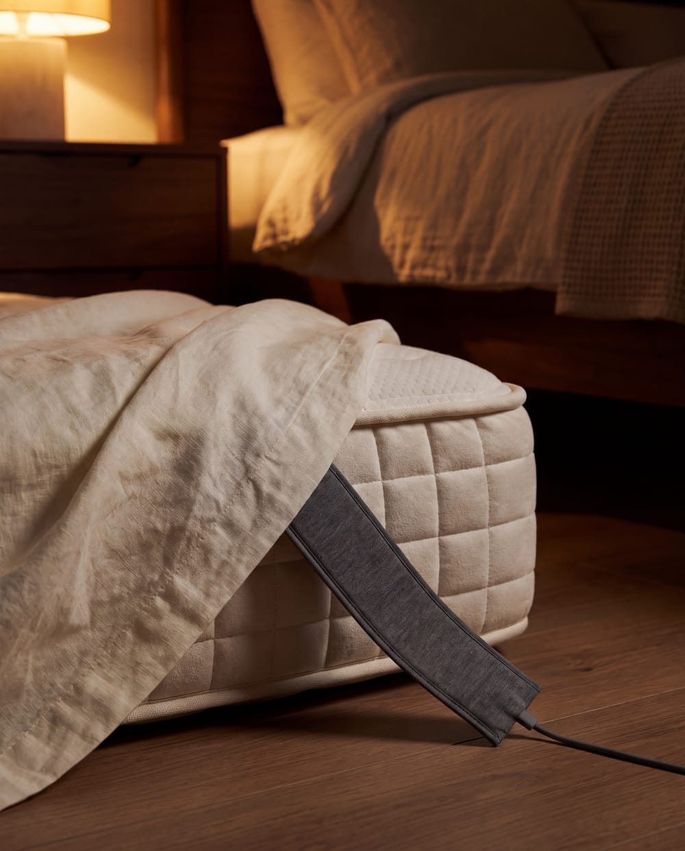 A sensor strip under a mattress