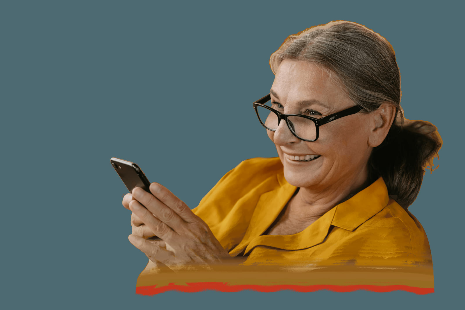 An older woman smiling at her phone